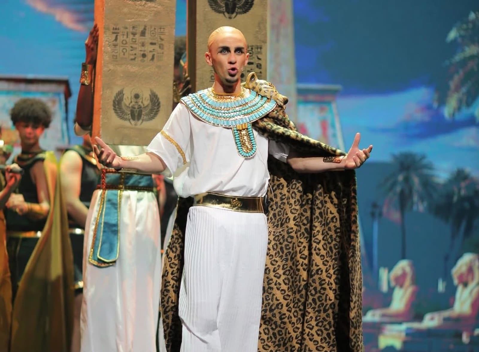Students in Egyptian costume perform on stage in the 2026 school production.